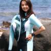 a female diver on the rock shore