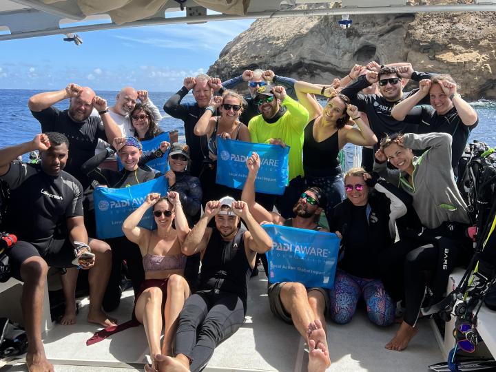 Group of people attending a PADI AWARE event.