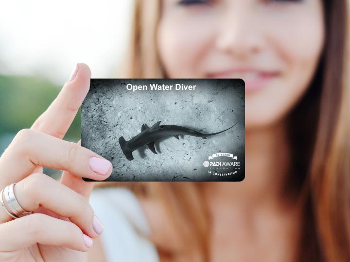 a women holding a card