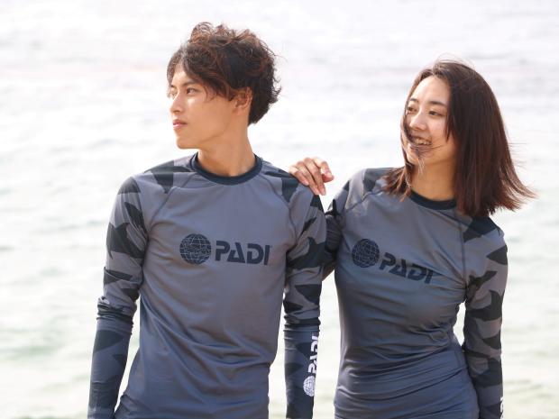 two models wearing padi gear rashguard