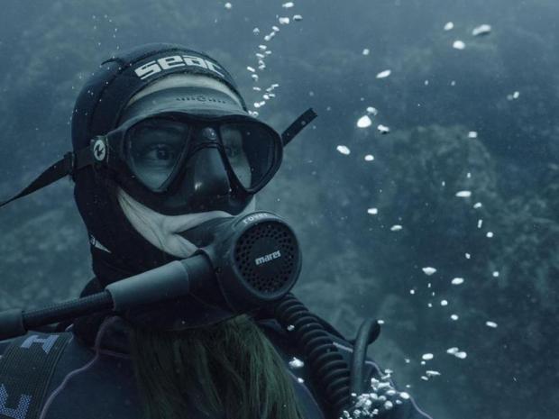 female diver underwater gazing