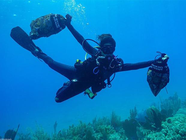 diver picking up ocean debris